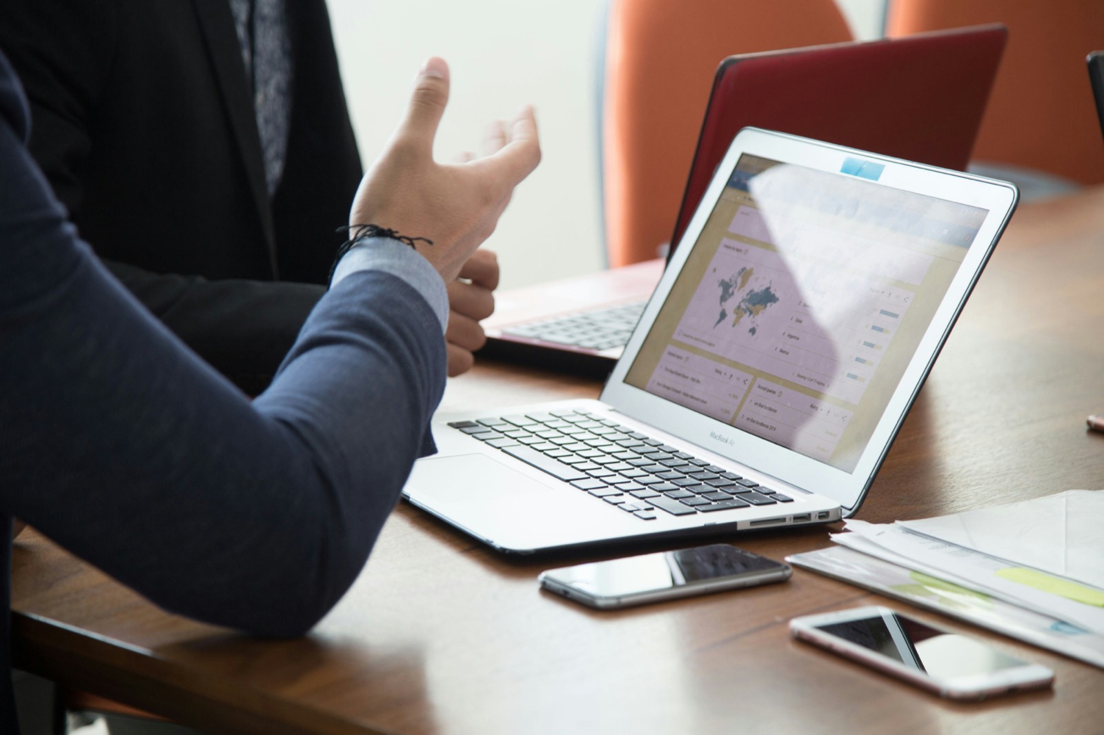 Consultants reviewing analytics on laptops